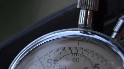 Stopwatch lies on bench, time shift concept Stock Footage 93654466