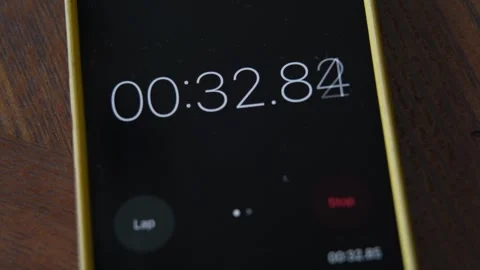 The stopwatch is running on the mobile phone screen Stock Footage 336883907