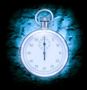 Stopwatch on wall background Stock Photos