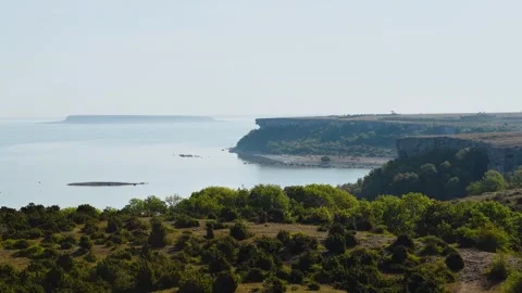 Stora Karlsö Cliffs View with Lilla Karlsö in Morning Haze Sweden Stock Footage 331553686