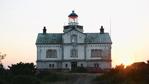 Stora Karlsö Lighthouse with Red Car at Sunset Gotland Sweden Stock Footage 331553826