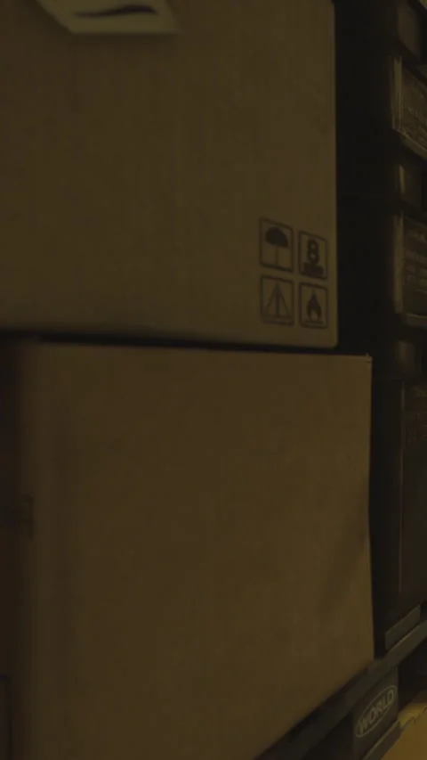 Storage area with bins and boxes during evening hours in a closed space Stock Footage 334724867