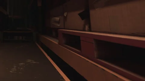 Storage area with shelves and boxes in a warehouse setting Stock Footage 345043903
