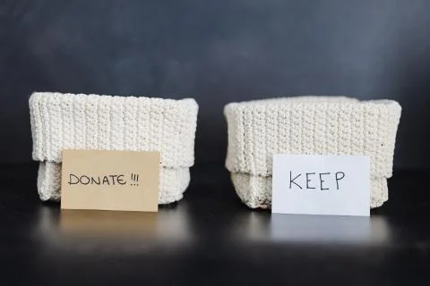 Storage baskets to divide items to keep from those to declutter or donate Stock Photos