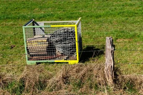 Storage container with tools in a grassy field on a sunny day Stock Photos