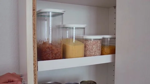 Storage Containers with Grains on Pantry Shelf, Tidy Home Organization Vídeo Stock 346067492