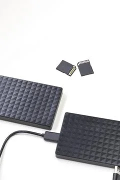 Storage device black external hard drive and sd Cards isolated on white Stock Photos
