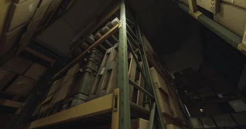 Storage facility filled with boxes on tall shelves at night Stock Illustration