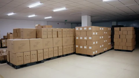 A storage facility filled with organised boxes. Warehouse with labeled Stock Footage 274182462