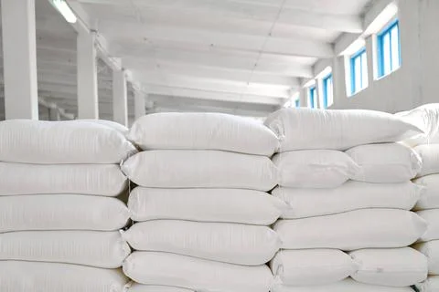 Storage facility for flour sacks showcasing organized stacks in a well-lit Stock Photos