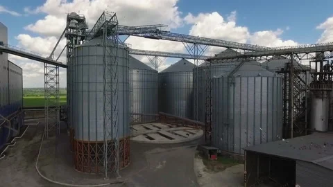 Storage facility for soy and wheat grains. Harvesting. Grain elevator aerial Stock-Footage 205603094