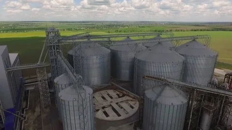 Storage facility for soy and wheat grains. Harvesting. Grain elevator aerial Video stock 211086374