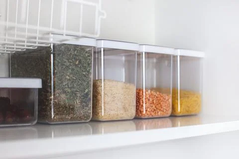 Storage ideas in the kitchen. White box and basket. Shelf order system. Stock Photos