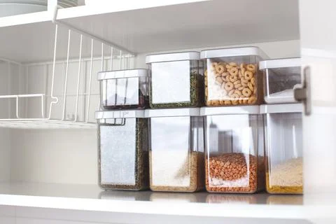 Storage ideas in the kitchen. White box and basket. Shelf order system. Stock Photos