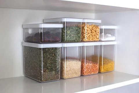 Storage ideas in the kitchen. White box and basket. Shelf order system. Stock Photos