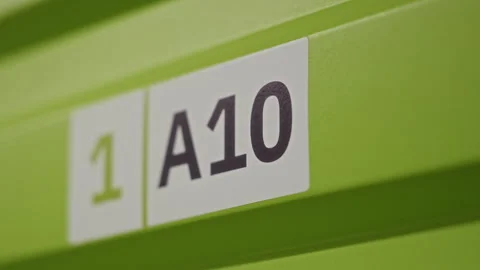 Storage Locker Number Label on Green Door Marking Individual Unit Stock Footage 340290166