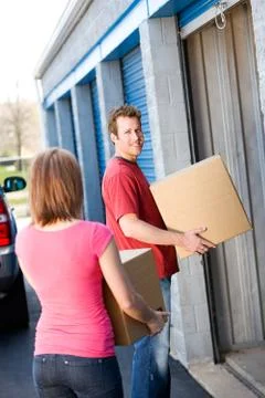 Storage: man putting stuff in storage Stock Photos