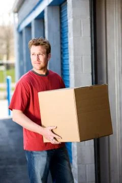 Storage: putting boxes in storage Stock Photos
