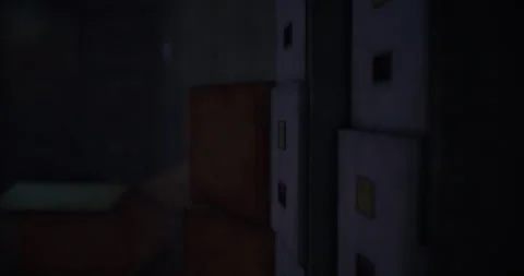 Storage room filled with boxes and lockers in a dimly lit environment Stock Footage 306039580