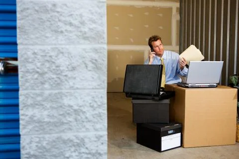 Storage: saving money by working in storage unit Stock Photos