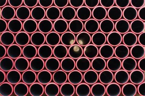 Storage of stacked plastic pipes Stock Photos
