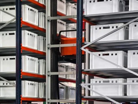 Storage system with clear containers in a warehouse during daylight Photos