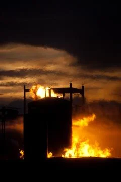 Storage tank on fire Stock Photos