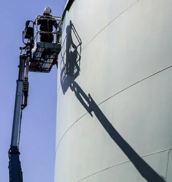 Storage tank work in refinery Stock Photos