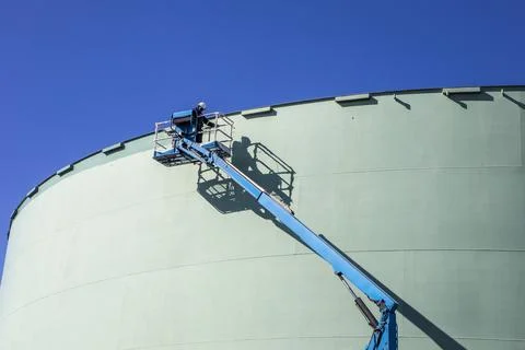 Storage tank work in refinery Stock Photos