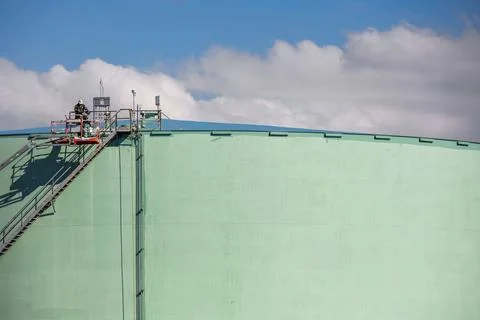 Storage tank work in refinery Stock Photos