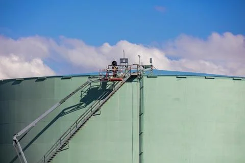 Storage tank work in refinery Stock Photos