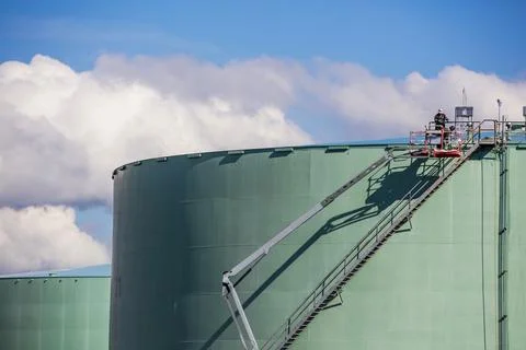 Storage tank work in refinery Stock Photos