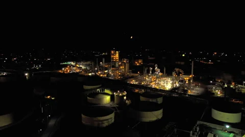 Storage Tanks And Processing Units At Petroleum Oil Refinery, Illuminated At Stock Footage 331227920