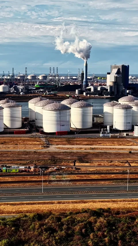 Storage Tanks and Smoking Stack at Industrial Port Complex Stock Footage 346581419