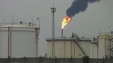 Storage tanks and torch Stock Footage 10274517