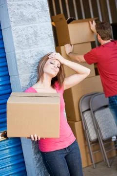 Storage: tired of working in storage unit Stock Photos