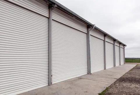 Storage units with roller shutter doors in industrial area Stock-Fotos