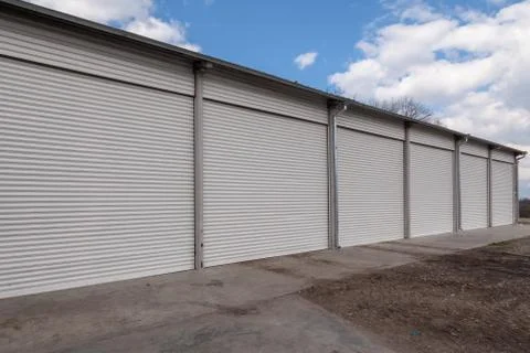 Storage units with roller shutter doors in industrial area Stock-Fotos