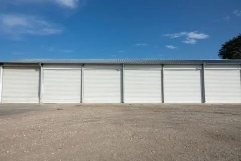 Storage units with roller shutter doors in industrial area Stock-Fotos