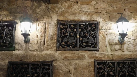 Storage of vintage wine in the wall of the cellar under the lock. Excursion Stock Footage 99797015