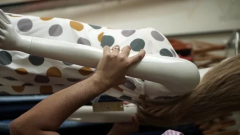 Store assistant working on the clothing store. Vertical video. Stock Footage 141475500