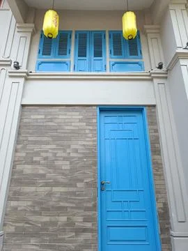 Store Front View with blue door with chinese modern interior. Retro Blue Door. Stock Photos