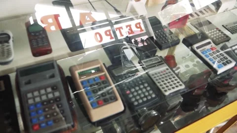 The Store Glass Counter With Old Electronic Equipment View With Reflection Stock Footage 218579995