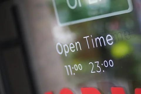Store hours display showing open time from 11:00 to 23 Photos