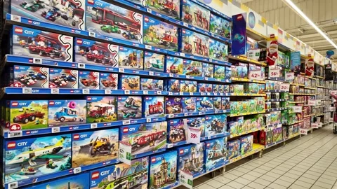 Store interior filled with Rayon Lego sets displayed neatly on shelves inside a Stock Footage 323285198
