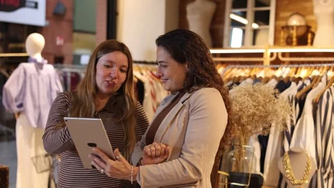 Store manager and employee using tablet for inventory Stock Footage 344314306