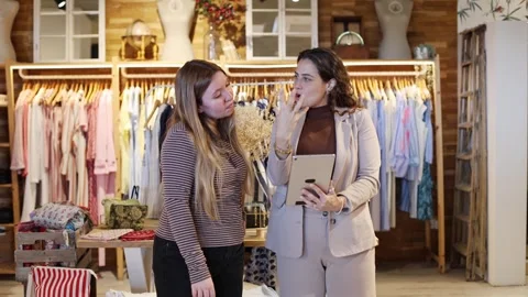 Store manager showing product catalog on tablet Stock Footage 335268662