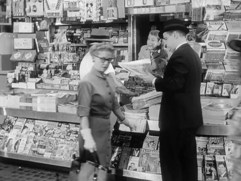 Store owner yells at a customer and the man interrupts - 1957 Video stock 95145271