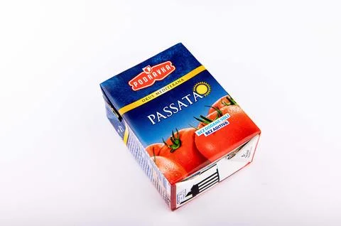 Store packaging of tomato paste on a white background. Stock Photos