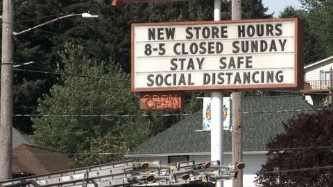 Store Posts New Hours During COVID Crisis Video stock 129748685